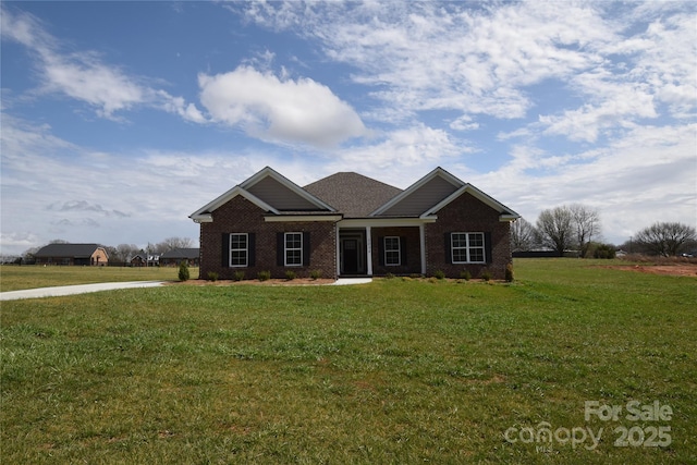 craftsman inspired home with a front lawn and brick siding