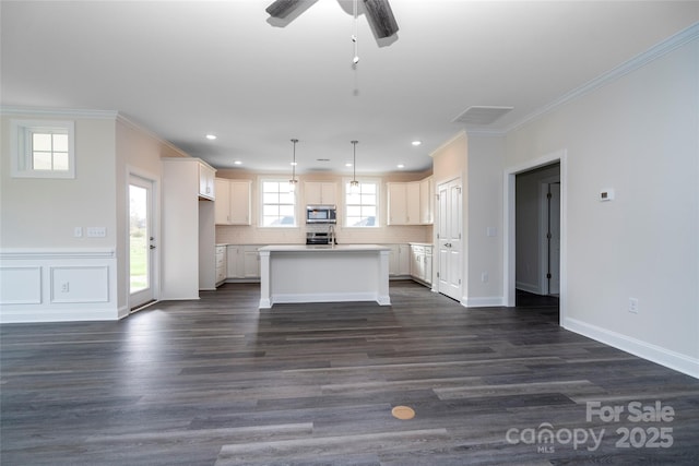 kitchen with appliances with stainless steel finishes, ornamental molding, decorative backsplash, and dark wood-style floors