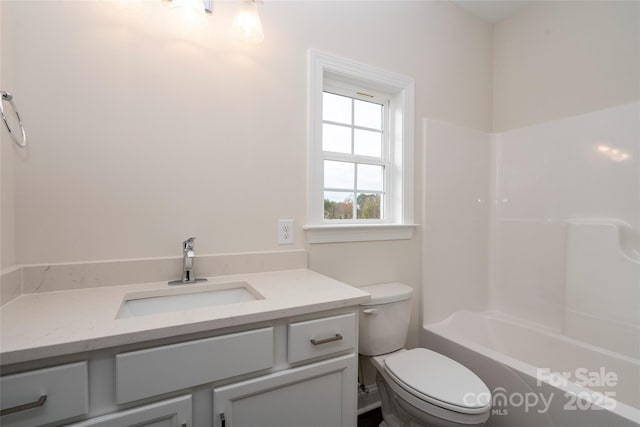 bathroom featuring toilet, shower / bath combination, and vanity