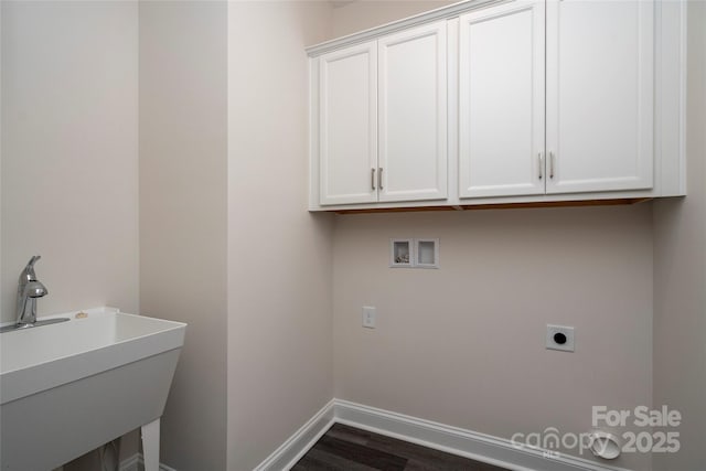 laundry room featuring washer hookup, a sink, baseboards, cabinet space, and electric dryer hookup