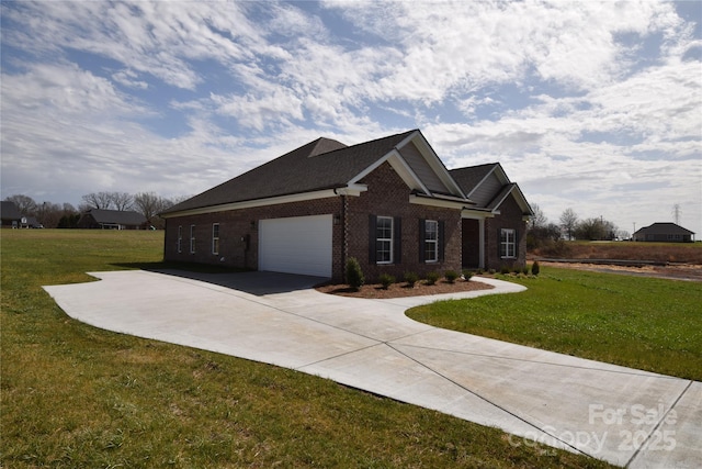 view of front of home featuring driveway, a garage, a front yard, and brick siding