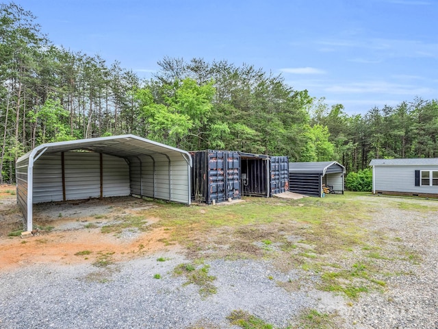 view of outbuilding with a carport