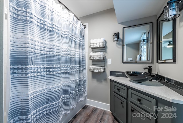 bathroom with shower / tub combo with curtain, vanity, and wood-type flooring