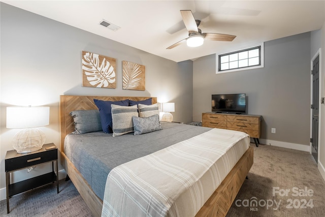 bedroom featuring ceiling fan and dark colored carpet