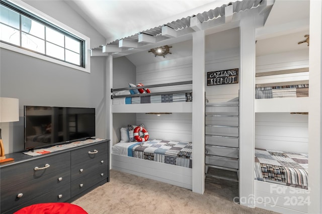 carpeted bedroom featuring vaulted ceiling