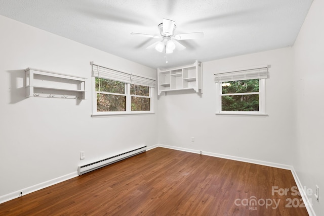 unfurnished room with ceiling fan, a baseboard radiator, a textured ceiling, and hardwood / wood-style flooring