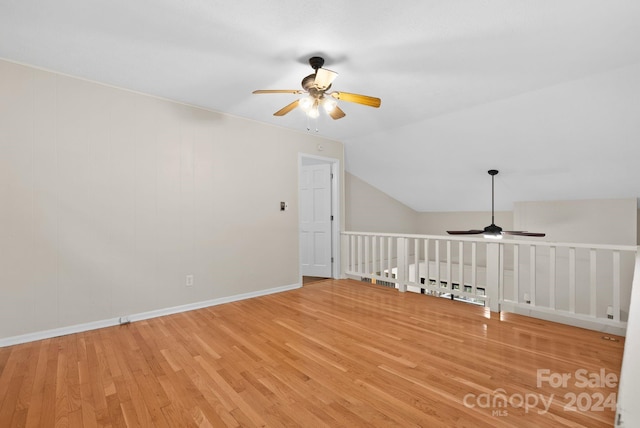 bonus room featuring hardwood / wood-style floors, ceiling fan, and vaulted ceiling