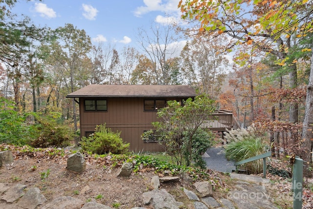 view of side of home with a deck