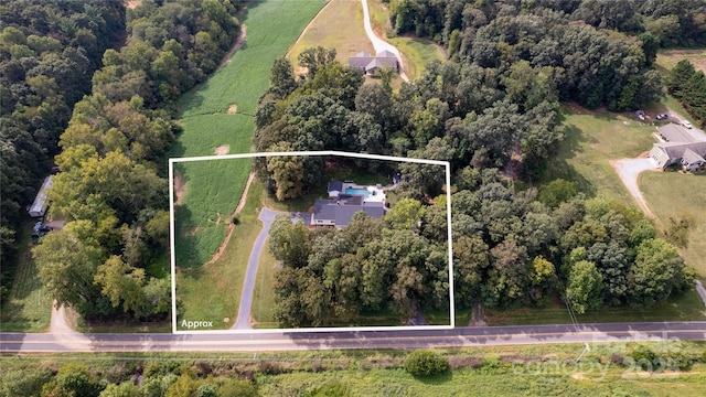 birds eye view of property featuring a rural view