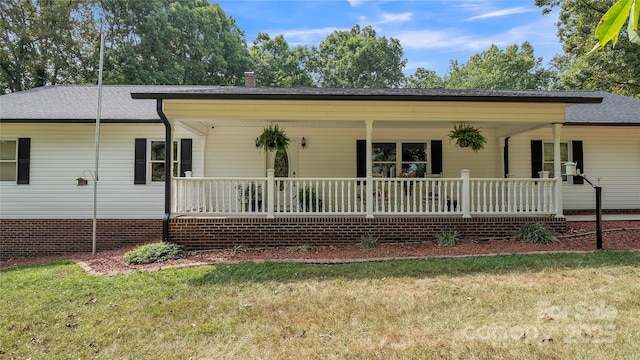 view of front of home with a front lawn and a porch