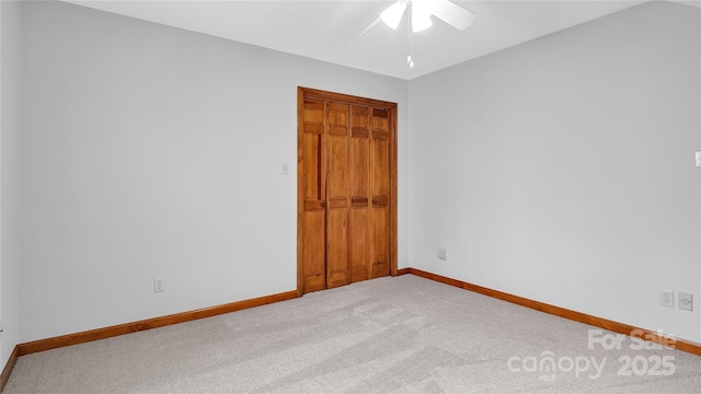 carpeted empty room with ceiling fan