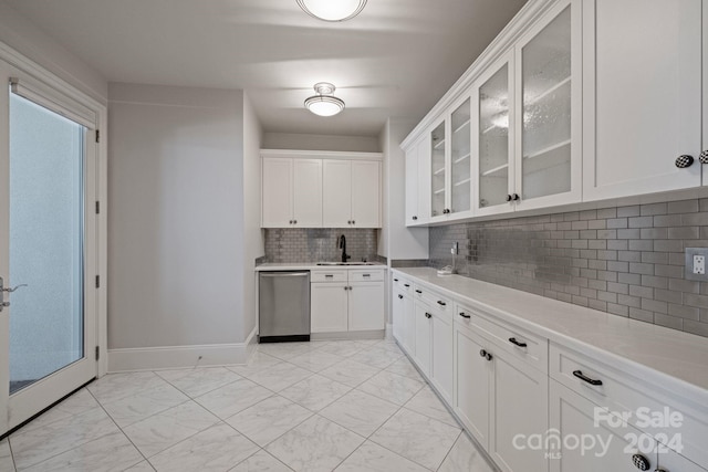 kitchen featuring white cabinetry, decorative backsplash, dishwasher, and sink