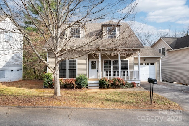 view of front facade featuring a garage and covered porch