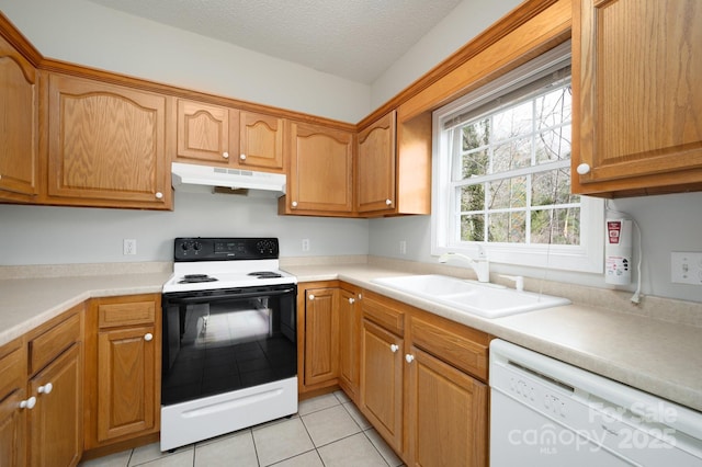 kitchen featuring sink, a textured ceiling, light tile patterned floors, electric range, and dishwasher