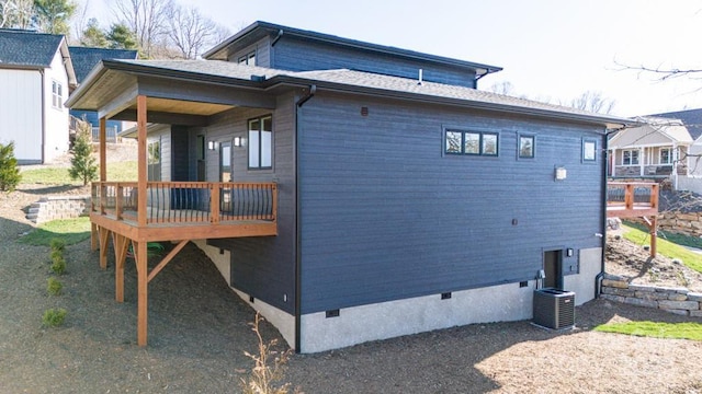 view of side of home featuring central air condition unit