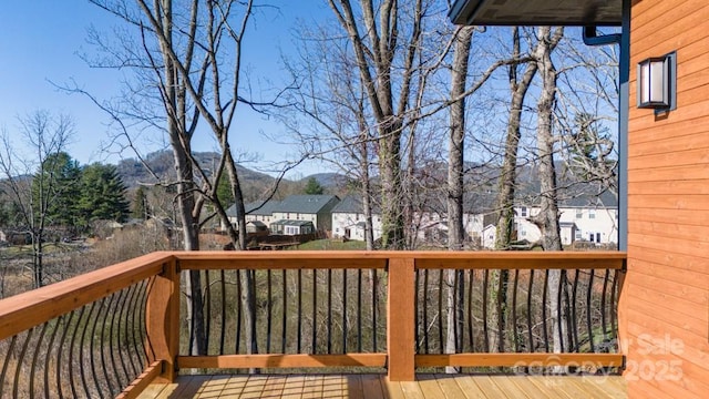 wooden deck with a mountain view