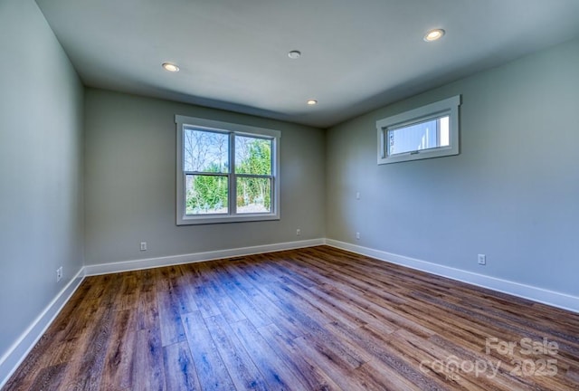 empty room with wood-type flooring