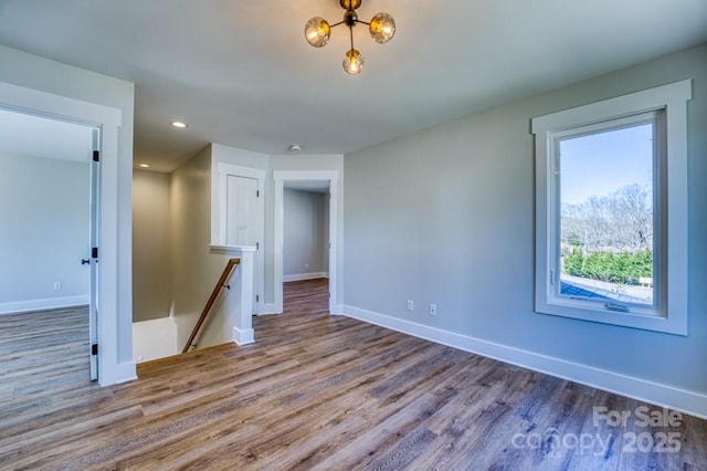 spare room with hardwood / wood-style floors