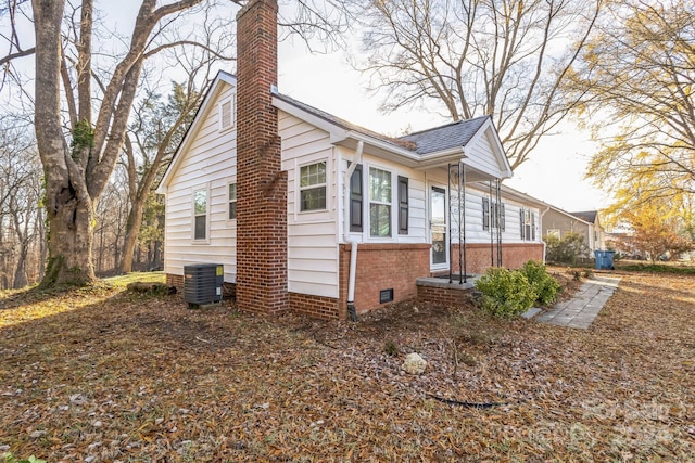 view of side of property featuring central AC unit