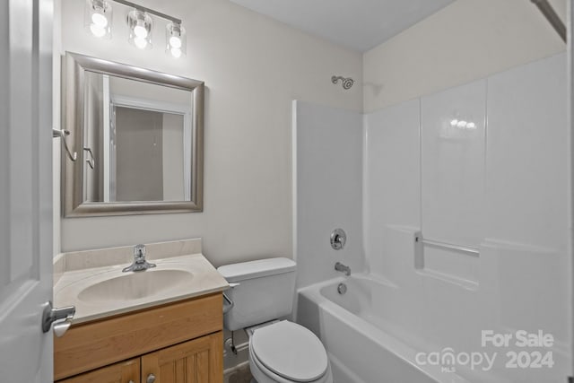 full bathroom featuring shower / bathing tub combination, vanity, and toilet