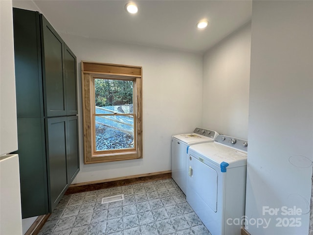 laundry area featuring washer and clothes dryer, recessed lighting, visible vents, cabinet space, and baseboards