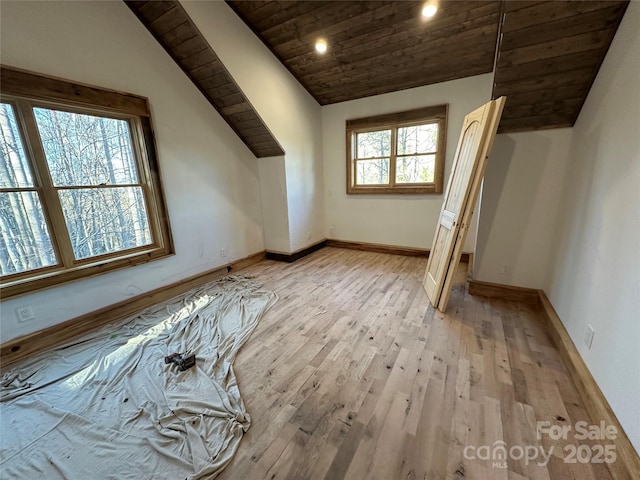 additional living space featuring recessed lighting, wood ceiling, vaulted ceiling, light wood-type flooring, and baseboards