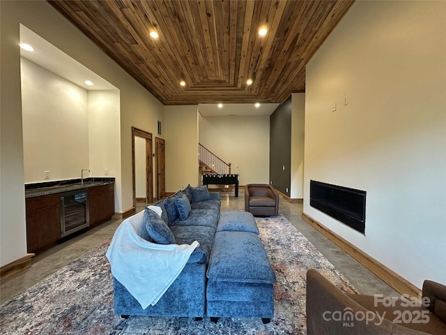 371 Hews Cir, Blowing Rock, NC 28605 - living room featuring wooden ceiling, beverage cooler, wet bar, finished concrete flooring, and recessed lighting