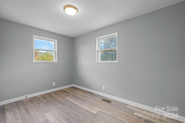 spare room featuring light hardwood / wood-style flooring