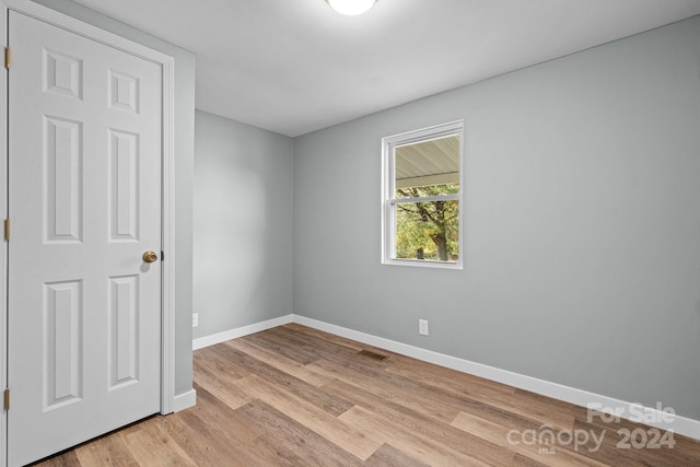 unfurnished room featuring light wood-type flooring