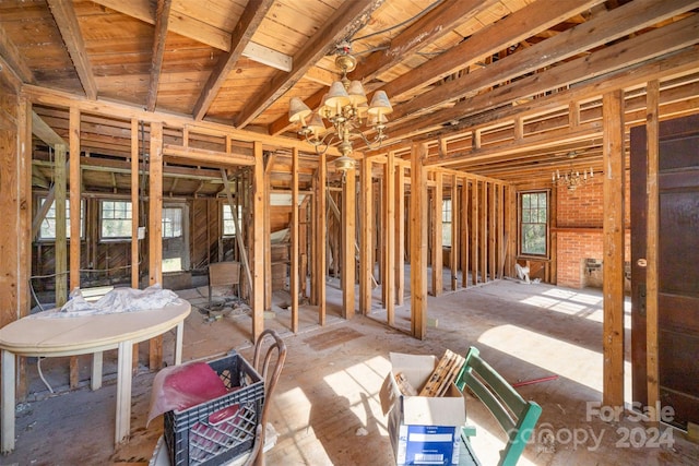 miscellaneous room featuring a notable chandelier