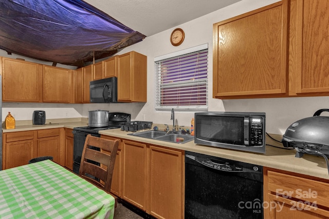 kitchen with sink and black appliances