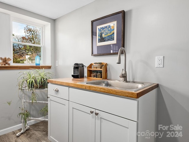 bathroom featuring vanity and hardwood / wood-style flooring