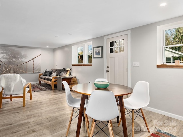 dining space with light wood-type flooring