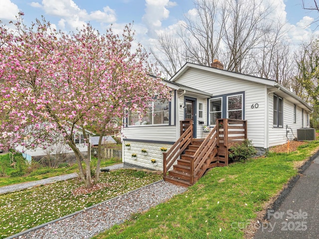60 Fulton St, Asheville, NC 28801 - view of front of home featuring a chimney, central air condition unit, and a front lawn