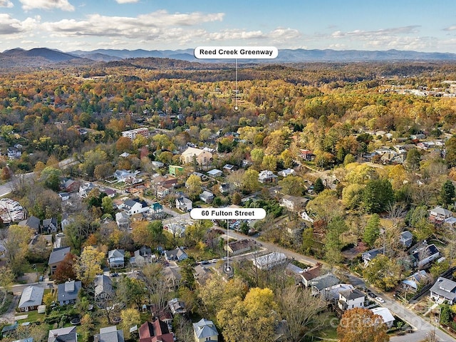 60 Fulton St, Asheville, NC 28801 - aerial overview of property's location with a mountainous background, a heavily wooded area, and nearby suburban area