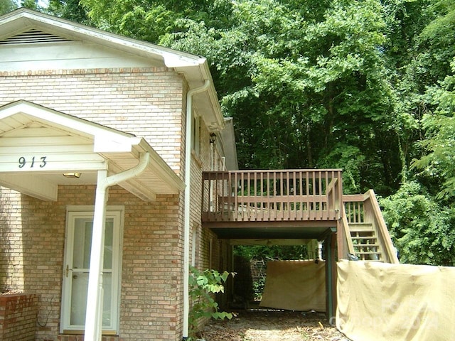 view of side of home featuring a deck