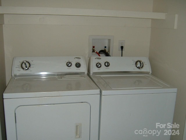 clothes washing area featuring washing machine and clothes dryer