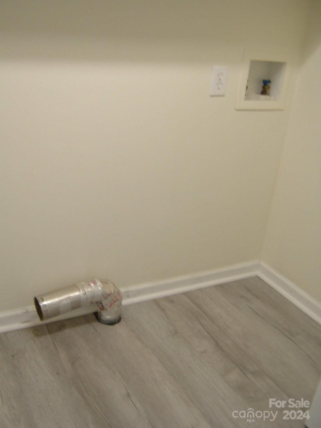 washroom featuring hookup for a washing machine and hardwood / wood-style flooring