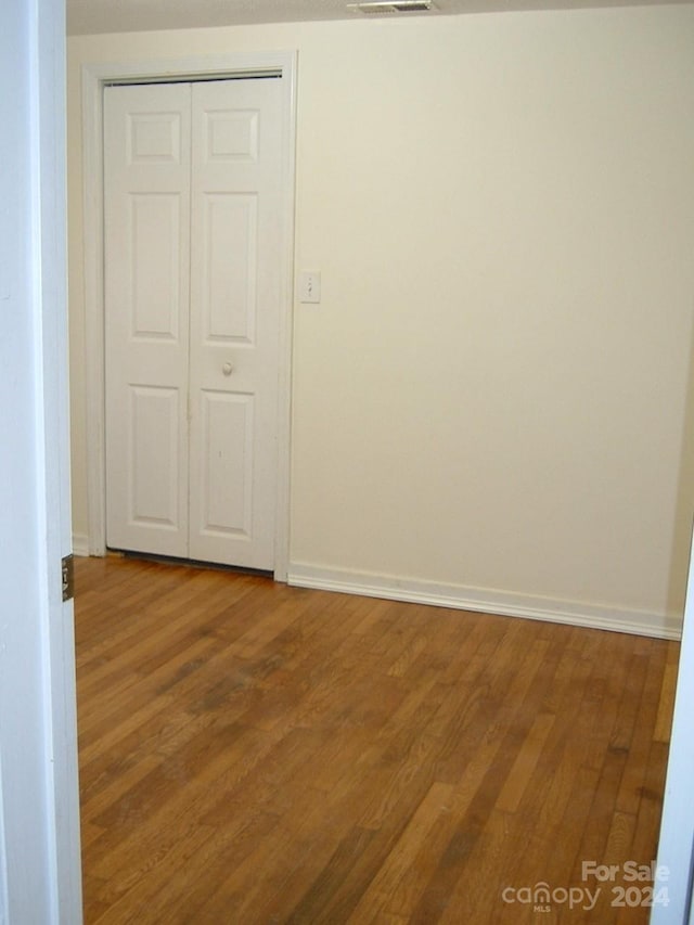 spare room featuring hardwood / wood-style flooring