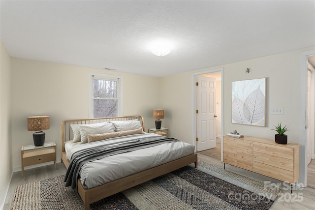 bedroom with dark hardwood / wood-style flooring