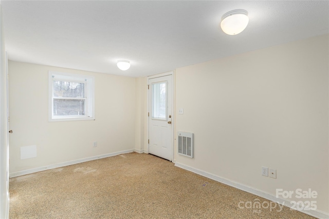 empty room featuring light carpet