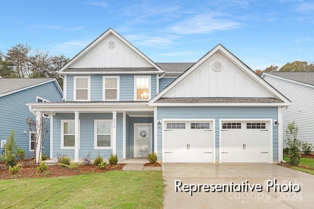 craftsman-style house with covered porch, a garage, and a front lawn