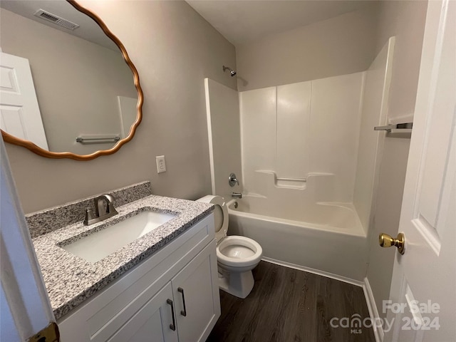 full bathroom featuring toilet, shower / tub combination, vanity, and wood-type flooring