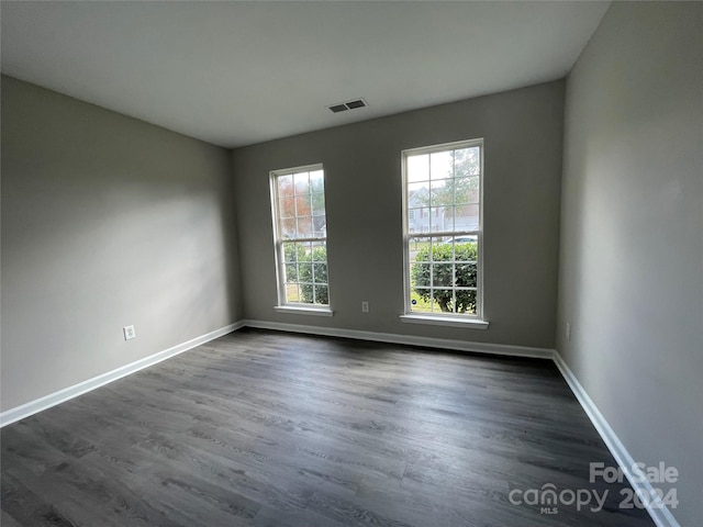 empty room featuring dark hardwood / wood-style floors