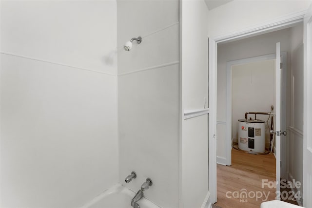 bathroom featuring electric water heater, shower / tub combination, and hardwood / wood-style floors