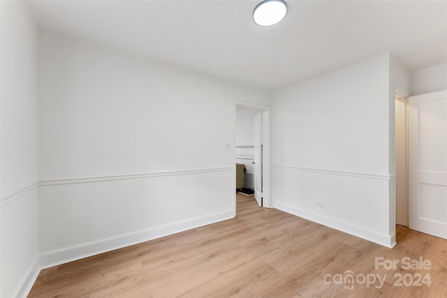 unfurnished room with light hardwood / wood-style floors