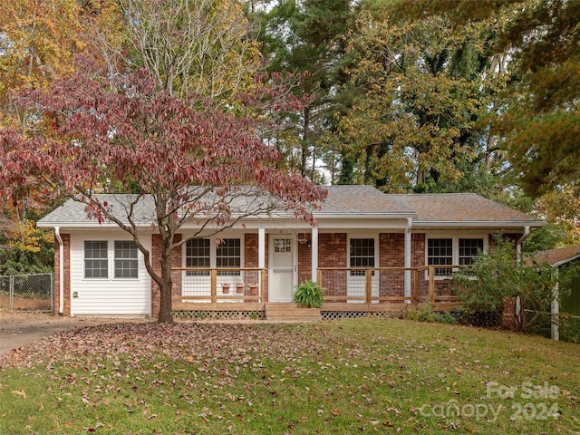 view of front of home featuring a front yard and a porch