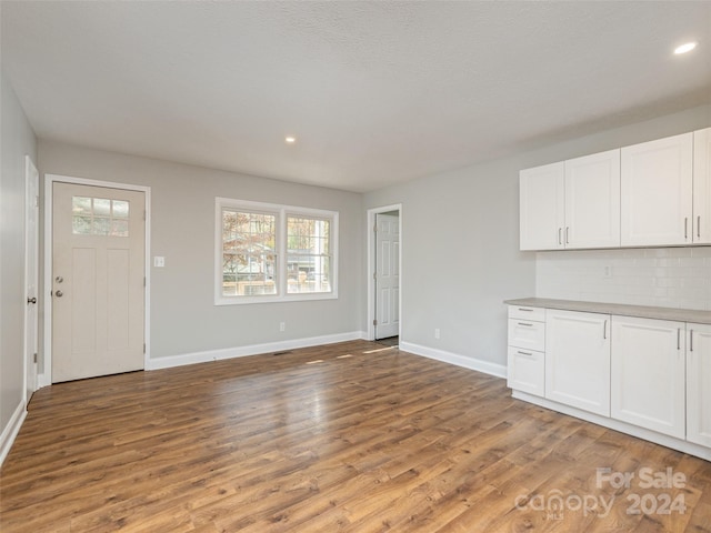 unfurnished living room with light hardwood / wood-style floors