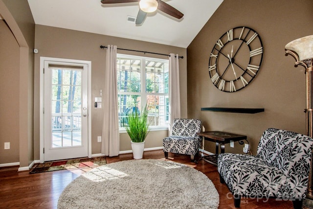 sitting room featuring dark hardwood / wood-style floors, vaulted ceiling, and ceiling fan