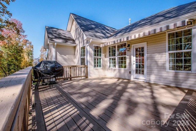 wooden deck featuring grilling area